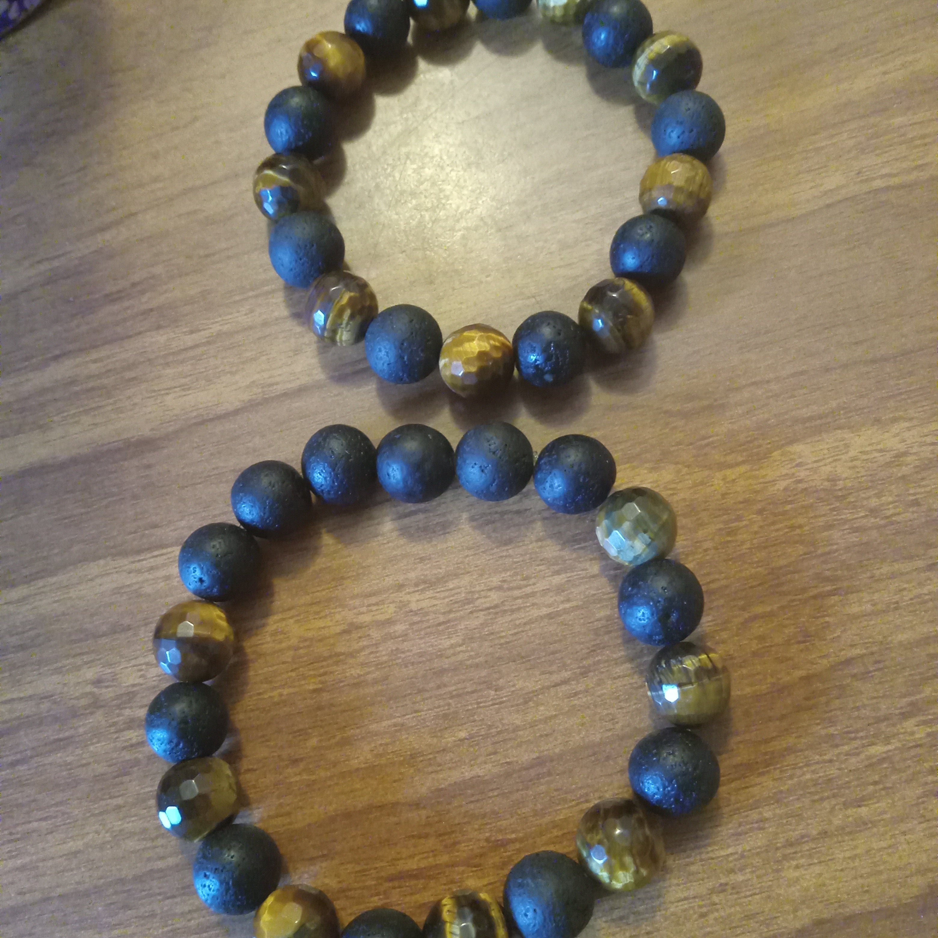 Men’s Black Lava & Tiger Eye Bracelet featuring natural stone beads for strength, confidence, and grounding energy—perfect for men’s fashion and spiritual jewelry collections.