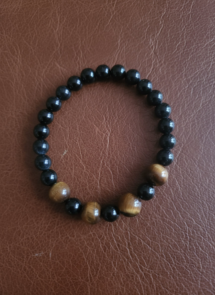 Beaded bracelet on a leather surface