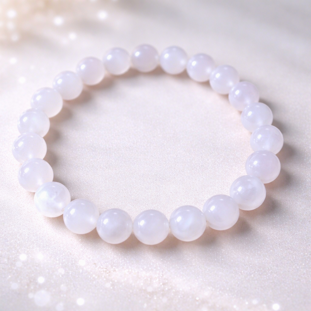 Pink beaded bracelet on a white background