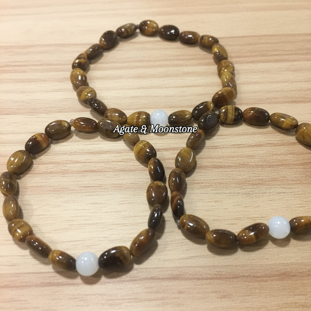 three bracelets with brown and  white stones